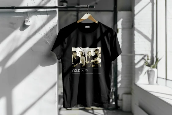 Front view of a unisex T-shirt featuring a graphic print of Coldplay bandmates, celebrating the band's iconic members